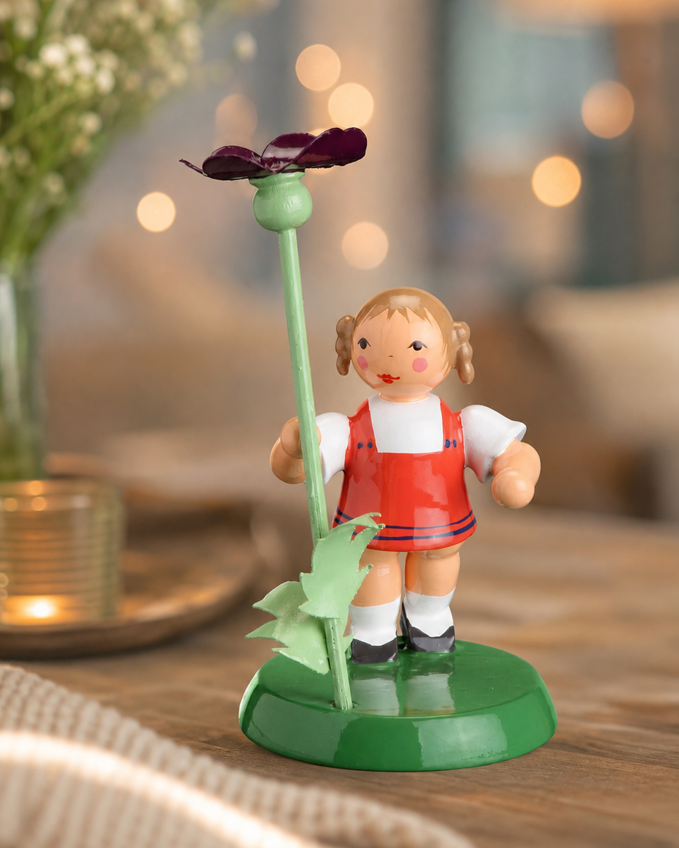 Blumenmädchen mit Stiefmütterchen